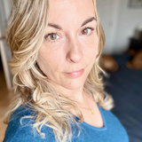 photo of Molly Robertson, woman with blond hair and a blue shirt